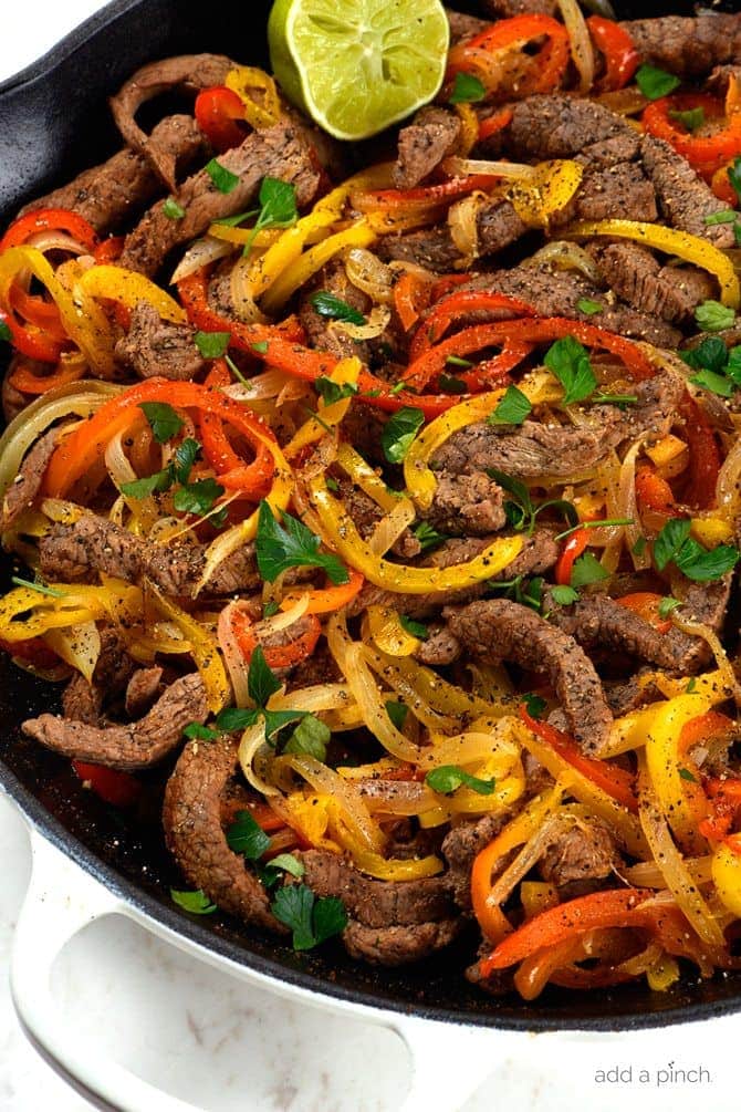 Steak Fajitas Recipe - Steak fajitas make a quick and easy meal perfect for weeknight suppers or weekend celebrations! // addapinch.com