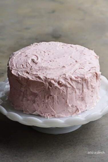 Strawberry Cake Recipe - Strawberry Cake made from scratch! This strawberry cake recipe is perfect for those looking for a homemade fresh strawberry cake. // addapinch.com