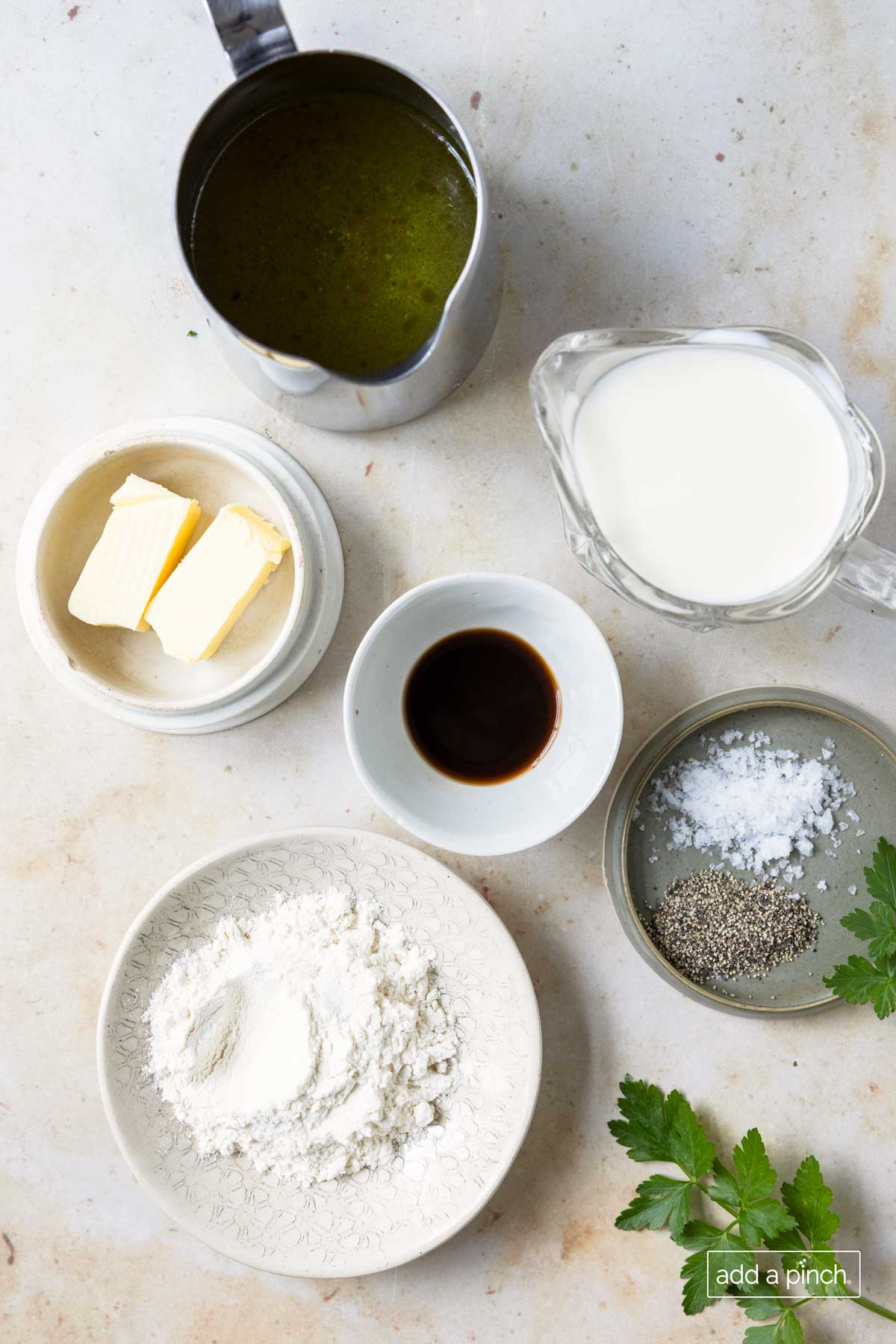 Ingredients to make Swedish Meatball Sauce in individual containers on a white surface.