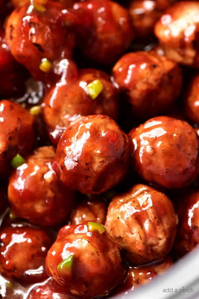 Sweet and Spicy Cranberry Cocktail Meatballs Recipe - An update on a classic party favorite, these sweet and spicy cranberry cocktail meatballs are always a hit! // addapinch.com