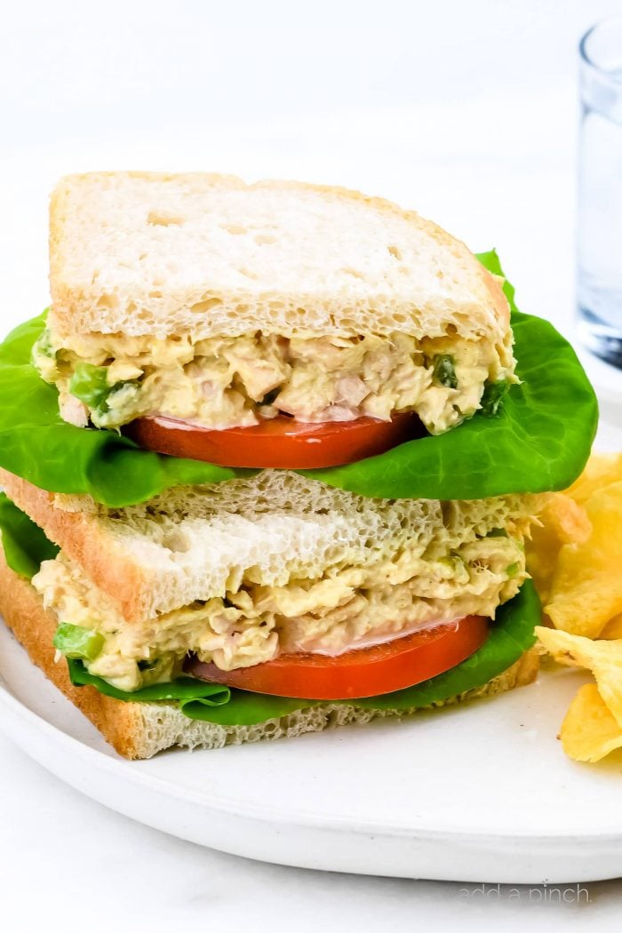 This tuna salad sandwich is so quick and easy and makes for a simple, yet scrumptious meal! Made with tuna, mayonnaise, and a few ingredients that make this the best tuna salad sandwich I've ever tasted! // addapinch.com